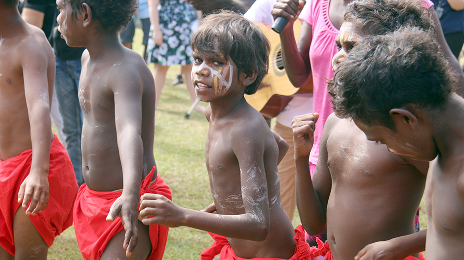 Children dance at the unveiling of the statue of Matthias Ulungura