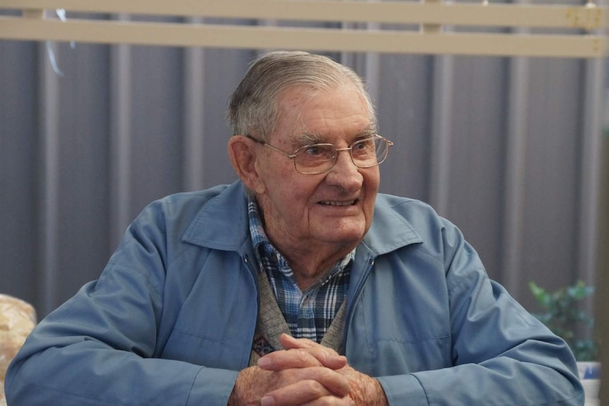 An elderly man smiling