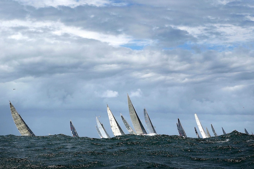 The fleet heads out to sea after the start of the 2012 Sydney to Hobart yacht race.