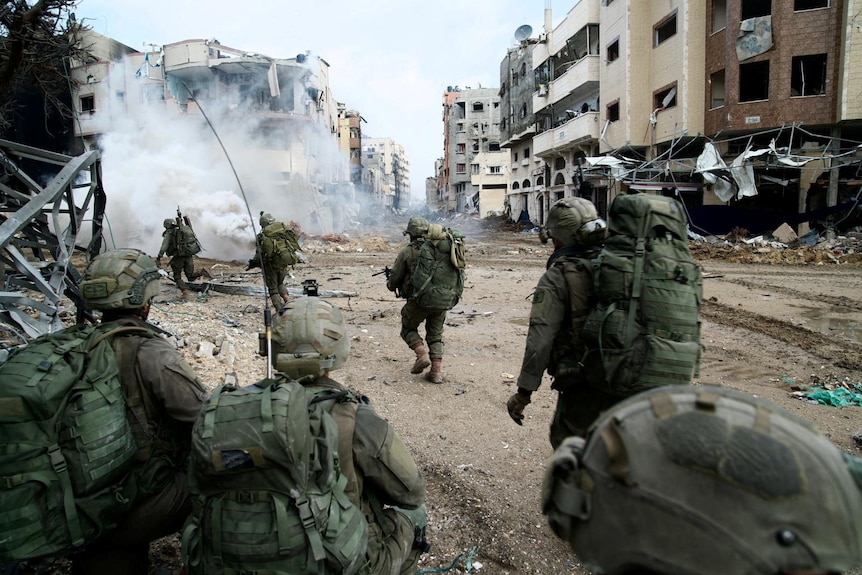 Israeli soldiers operate in the Gaza Strip amid the ongoing conflict between Israel and Hamas.