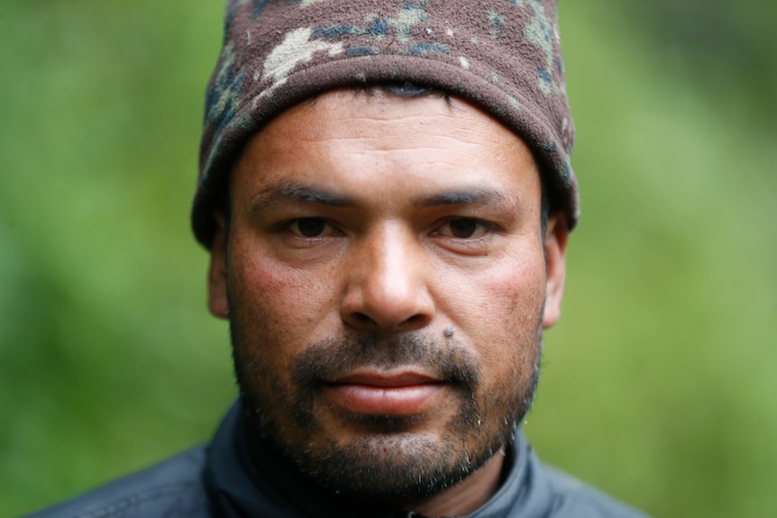 Man poses for a headshot photograph.