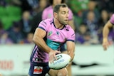 Cameron Smith passes the ball against South Sydney