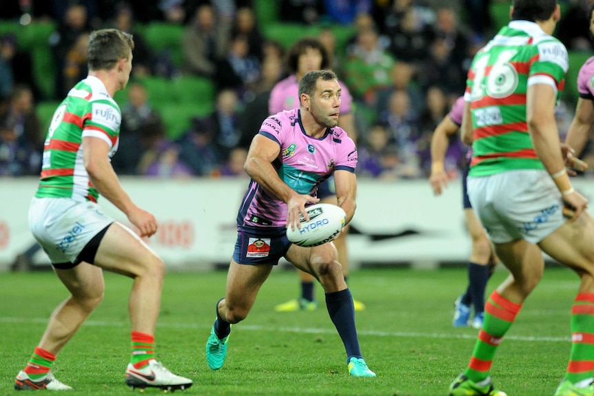 Cameron Smith passes the ball against South Sydney