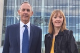 Bob Brown and Jessica Hoyt have their photograph taken outside the High Court in Canberra.