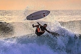 Surfer experiencing a wipe out
