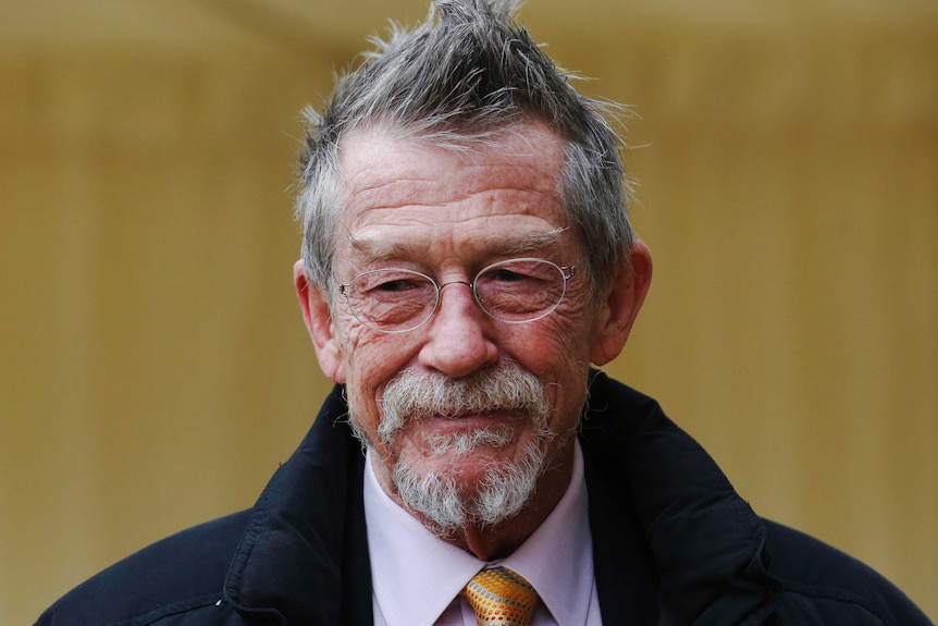 British actor John Hurt smiles as he arrives for a reception for the British Film Industry.