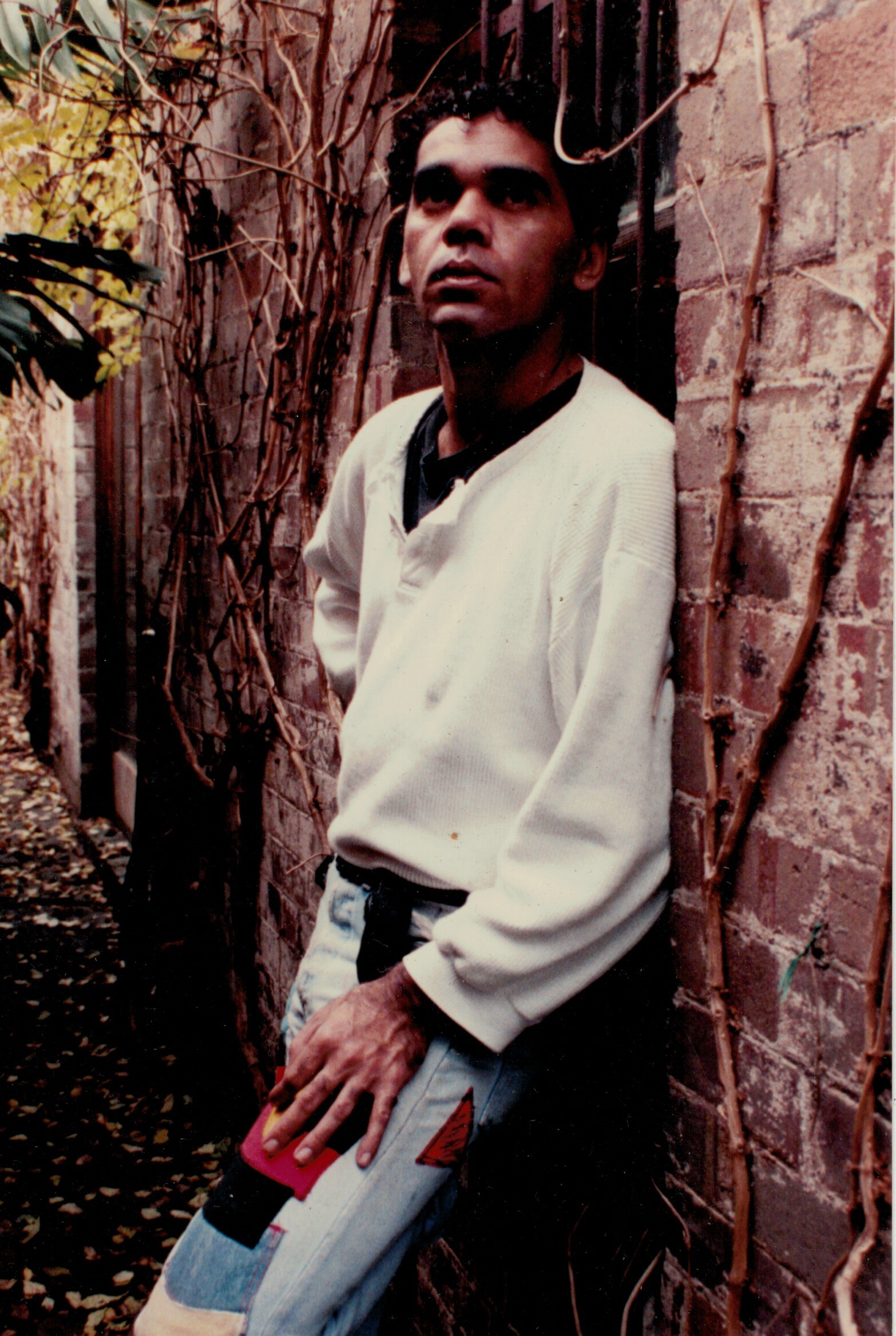 Young man standing in a doorway 