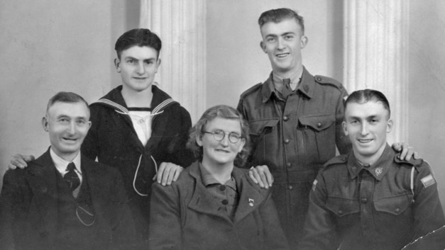 A black and white photo of Teddy Sheean and family members.