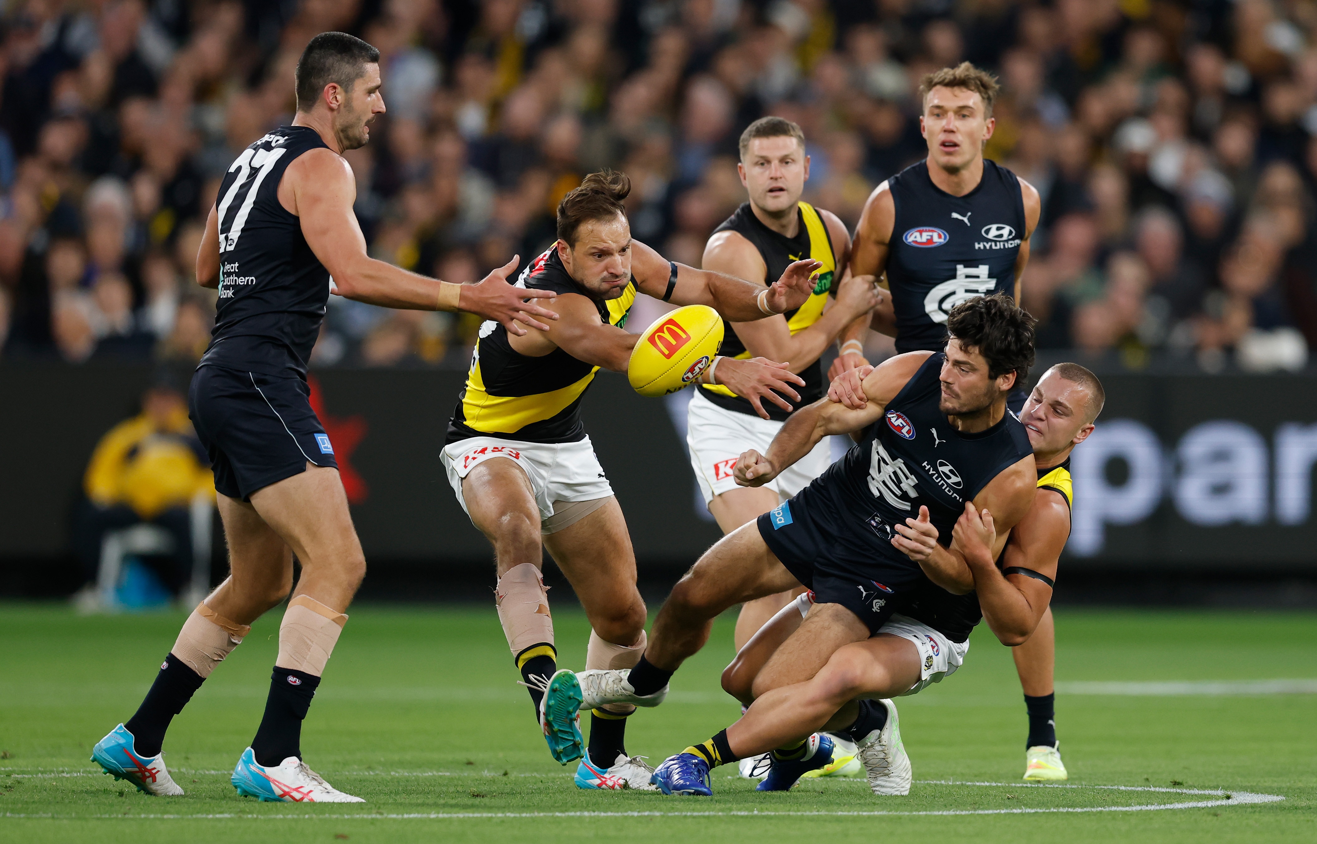 Live: Blues and Tigers ignite first full round of AFL season at packed MCG
