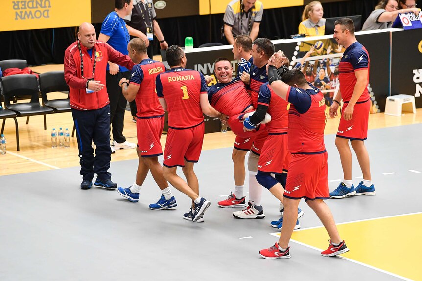 The Romanian sitting volleyball team celebrate a win at the Invictus Games