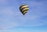 Hot air balloon airborne over Tasmania.