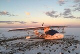 A light aircraft rests on the sands of Lake Eyre in outback South Australia after an emergency landing.