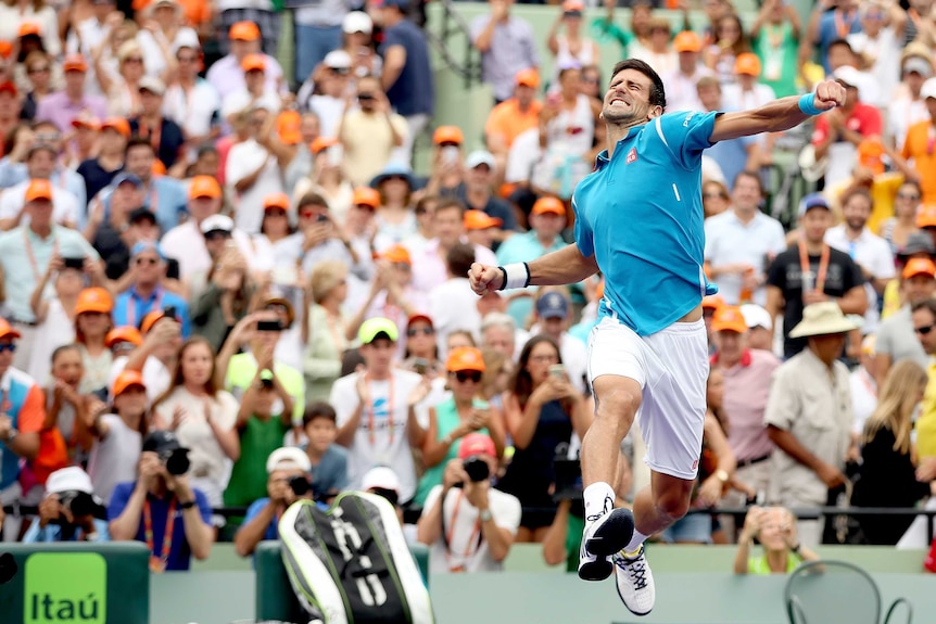 Novak Djokovic jumps for joy after winning the Miami Masters