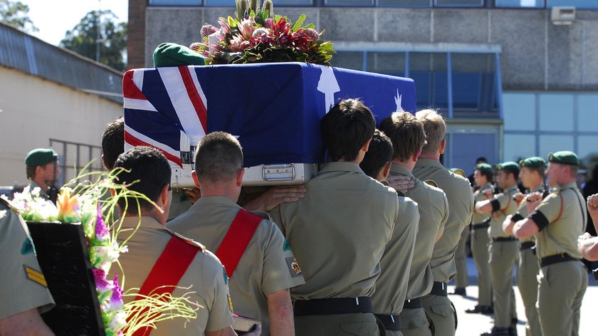 Soldiers from Lance Corporal Marks' battalion carried his casket from the plane