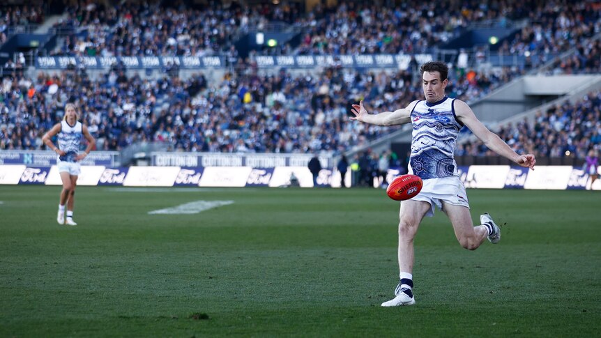 Jeremy Cameron kicks a goal from outside 50 for Geelong