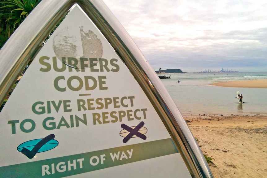 Surfers code sign at Currumbin Beach