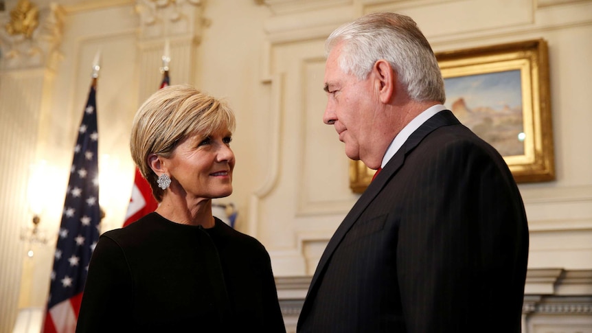 Foreign Minister Julie Bishop stands opposite Rex Tillerson in an official room of the state department