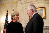 Foreign Minister Julie Bishop stands opposite Rex Tillerson in an official room of the state department