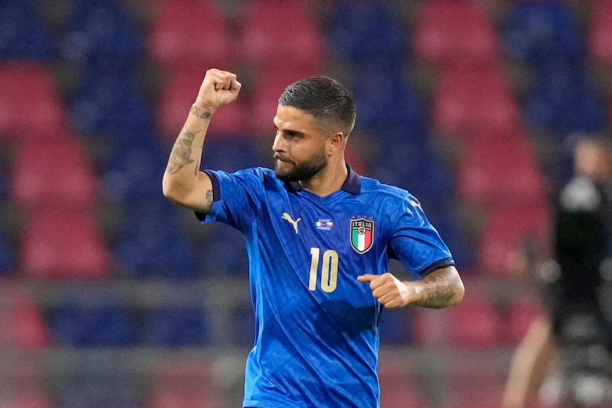 Lorenzo Insigne holds his hand up and clenches his fist