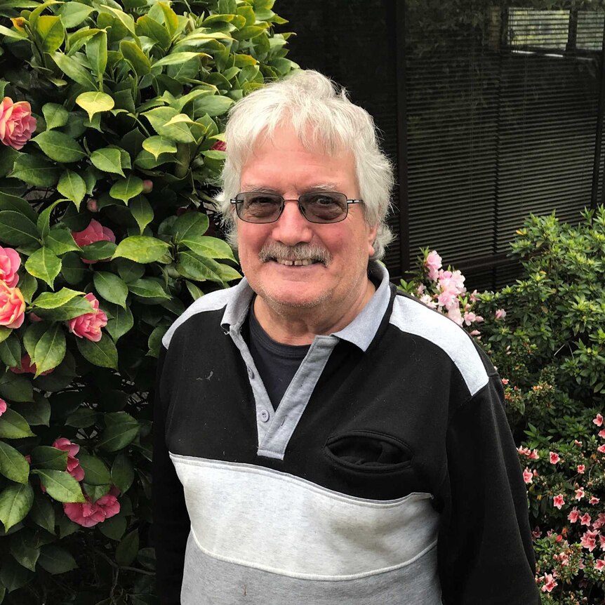 "Ten pound pom" Mike Griffiths standing in his garden