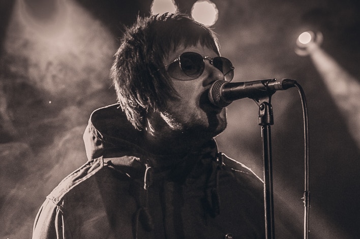 A member of the British Oasis tribute band, Oas-is, during a performance