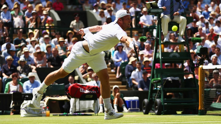 Sam Groth returns against Federer