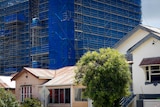 Apartment construction sites loom over old standalone houses in West End, inner-city Brisbane.