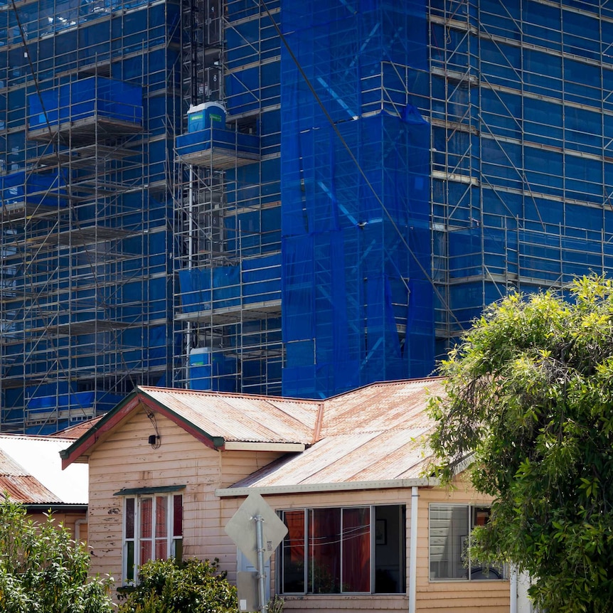 Apartment construction sites loom over old standalone houses in West End, inner-city Brisbane.