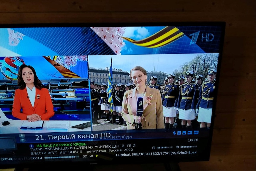 Photo shows tv screen with Russian text