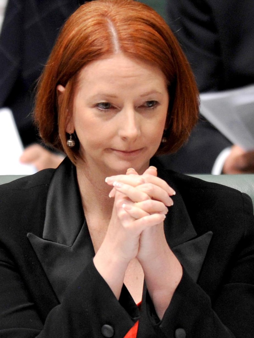 Prime Minister Julia Gillard listens during House of Representatives question time