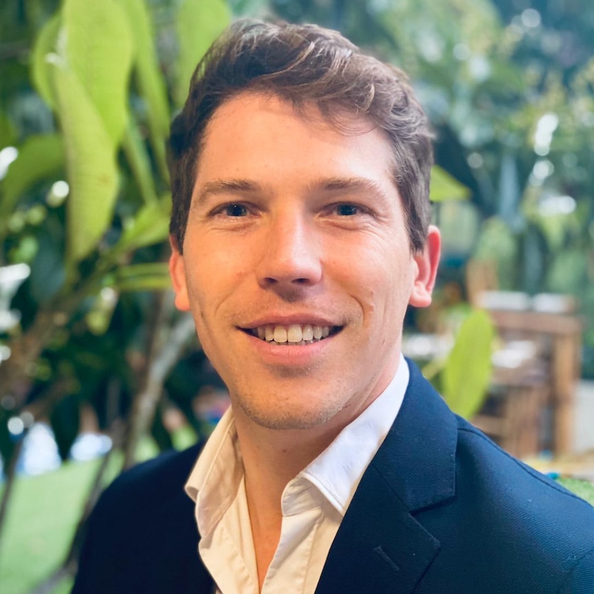 A headshot of TerraCycle general manager Jean Bailliard in front of a green, garden setting