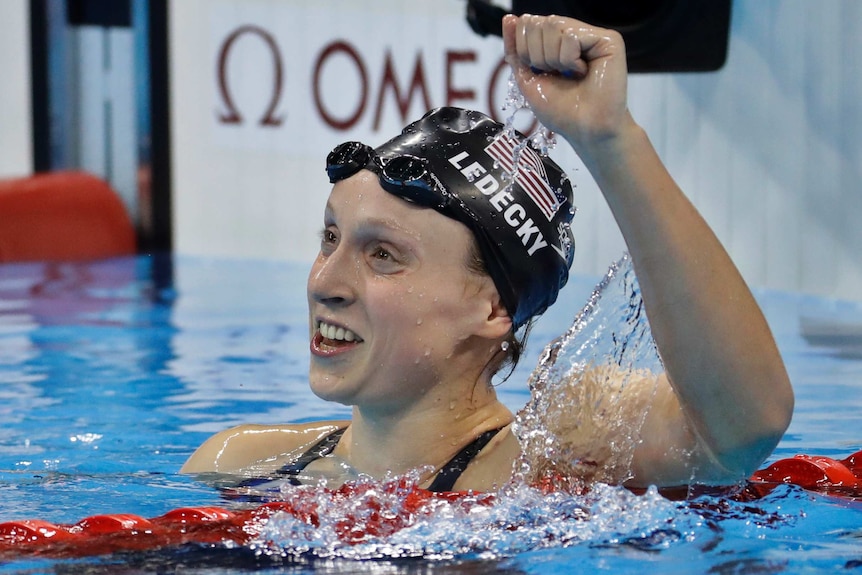 Unites States' Katie Ledecky celebrates after winning gold in the women's 800-meter freestyle