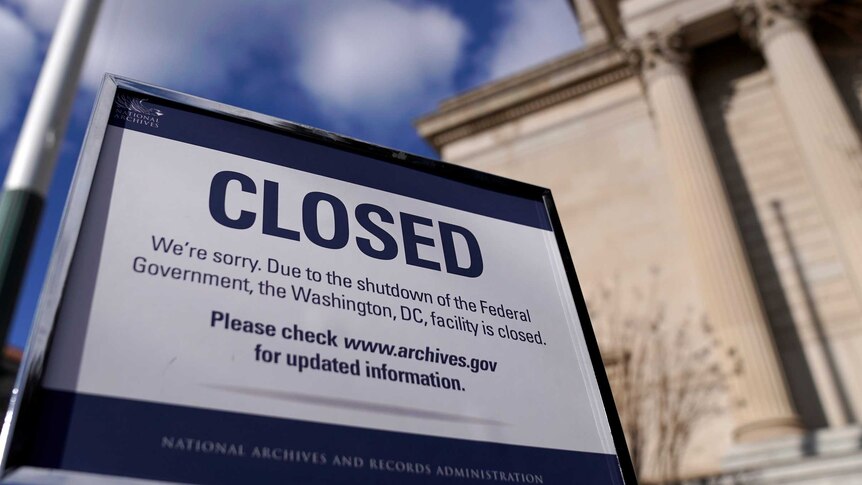 A sign that says CLOSED in capital letters outside the US National Archive during the federal government shutdown.