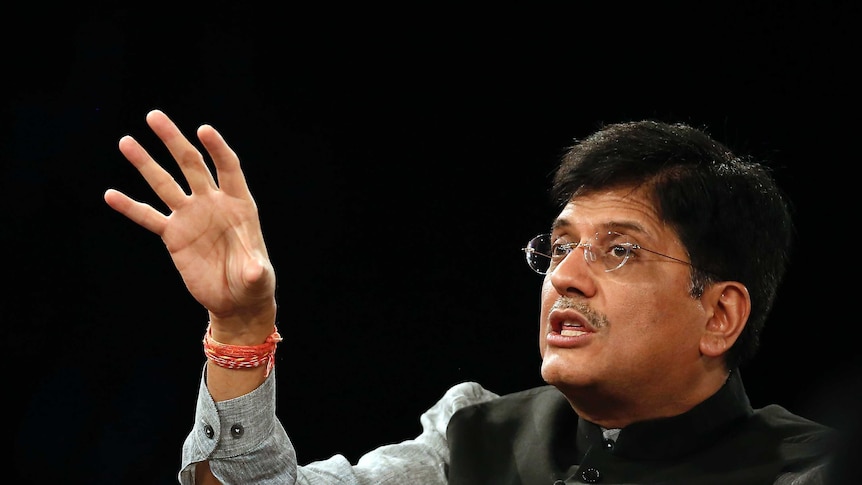 India's Power Minister Piyush Goyal gestures with his right hand as he speaks at a summit.
