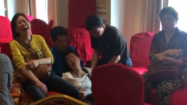 A woman in Nanjing weeps as she waits to hear news about relatives on the Yangtze ferry disaster