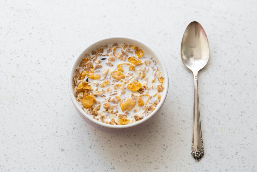 A bowl of cereal and spoon