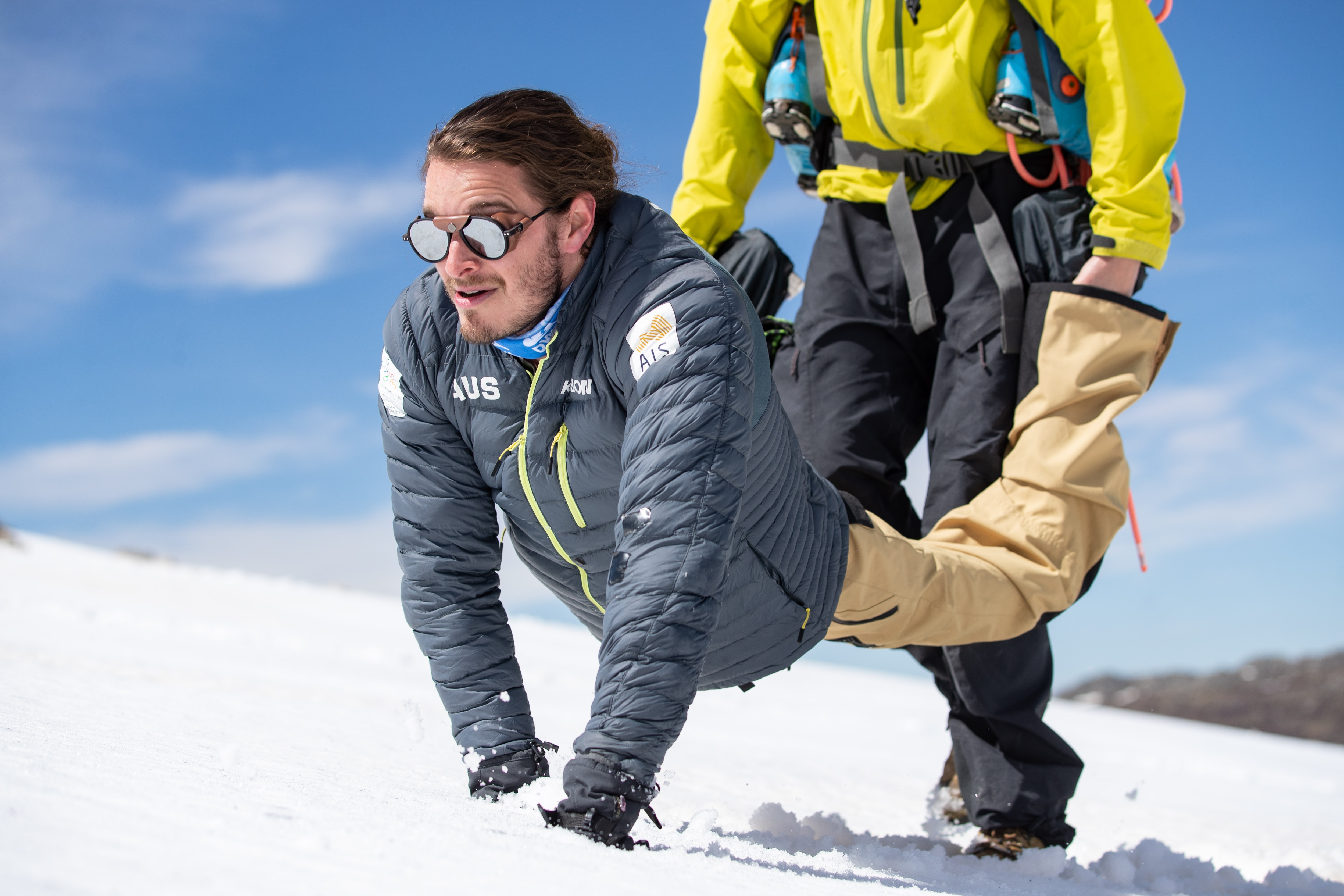 Sam is carried in a 'wheelbarrow' position uphill.