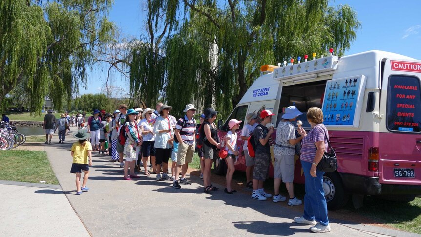 Queue for the ice-cream truck on the shores of Lake Burley Griffin as part of Canberra's centenary celebrations.