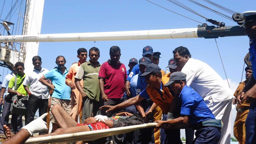 Asylum seeker stretchered off boat in Sri Lanka