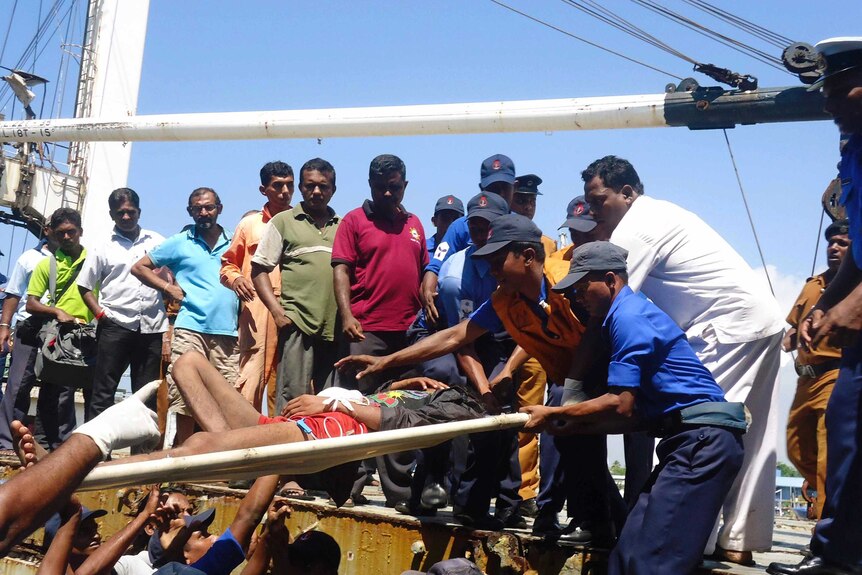 Asylum seeker stretchered off boat in Sri Lanka