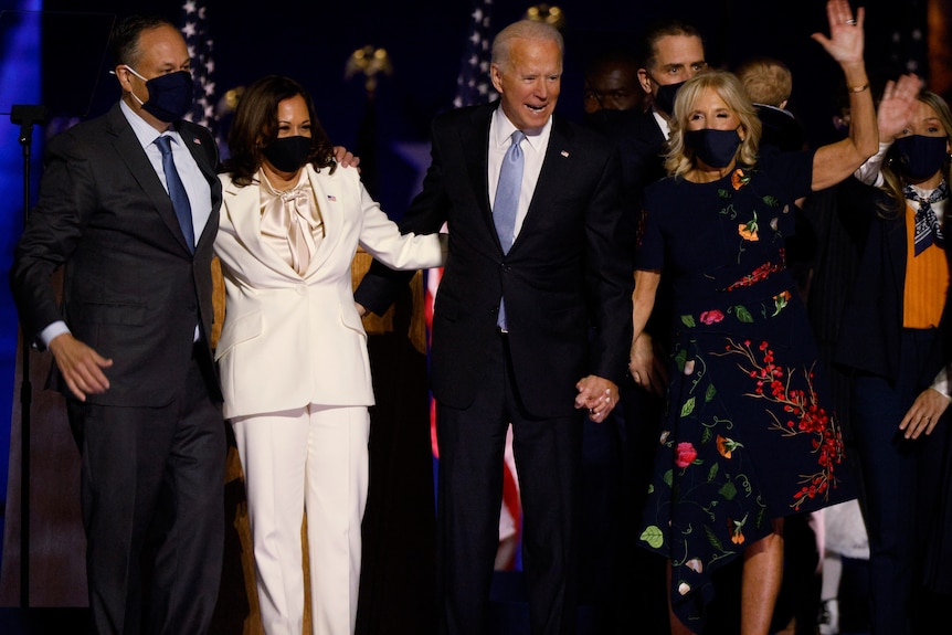 President-elect Joe Biden and vice-president elect Kamala Harris on stage with their partners.