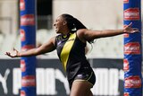 Sabrina Frederick stretches her arms out wide as she celebrates a goal for Richmond in the AFLW in 2020.