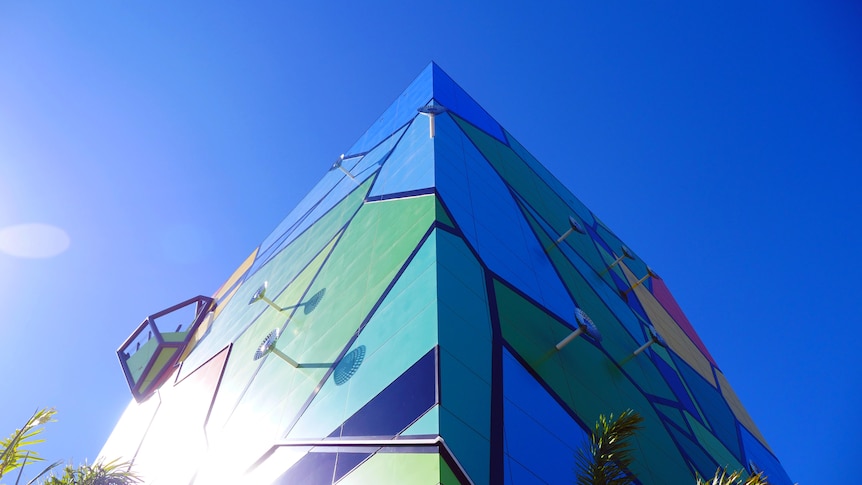 A colourful, triangular building.
