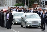 Mourners line the way of the cortege at the funeral of Melbourne baseballer Chris Lane, August 28, 2013