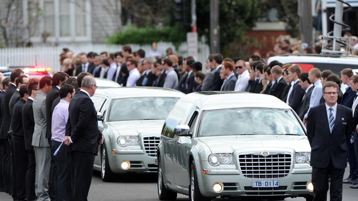 Mourners line the way of the cortege at the funeral of Melbourne baseballer Chris Lane, August 28, 2013