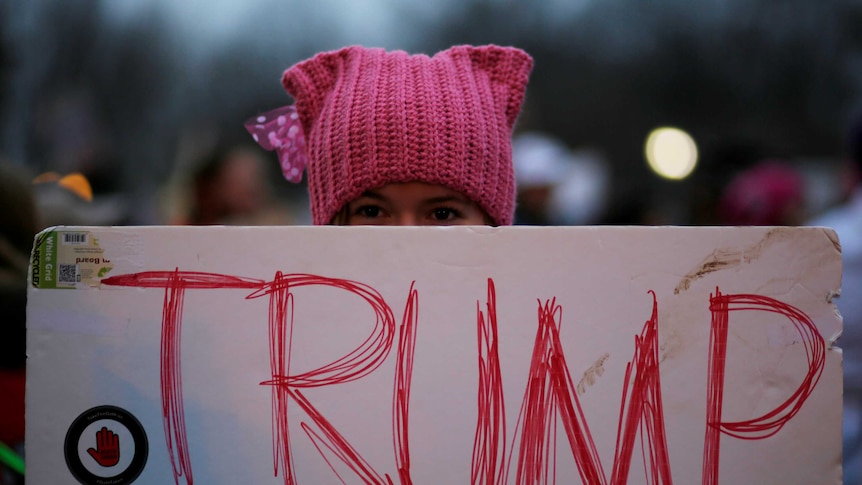 Woman at a protest march against Donald Trump
