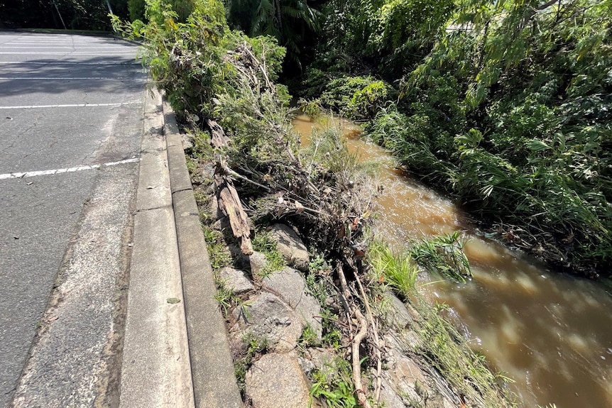 A car park backing onto a creek.