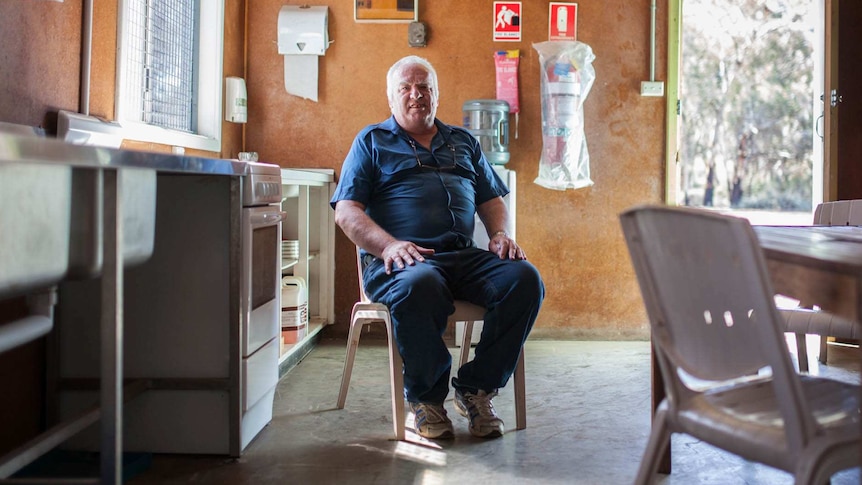 A man sits in the lunchroom of the Kambalda men's shed, WA.