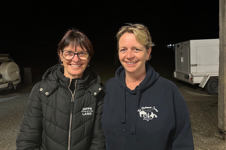 Janine Hayes pictured left wearing a black puffer jacket with Kathy Williams in a blue jumper at Stockmans Camp in Buchan