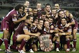 The victorious Queensland side with the Origin shield.